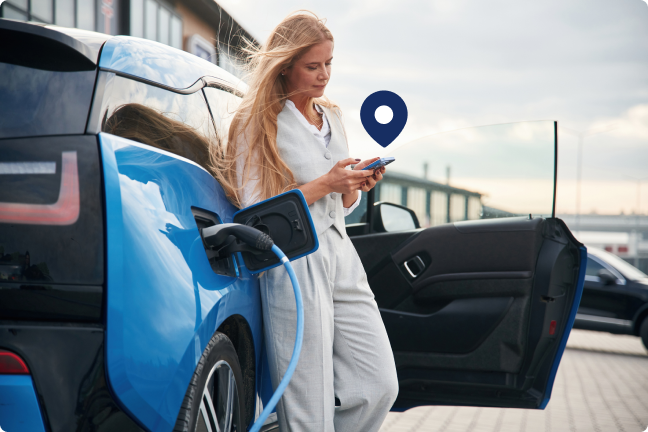 A woman is charging her EV
